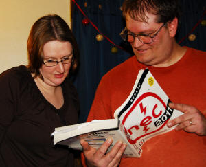 Jonathan explains something to Elaine Fitzpatrick out of the National Electrical Code book.
